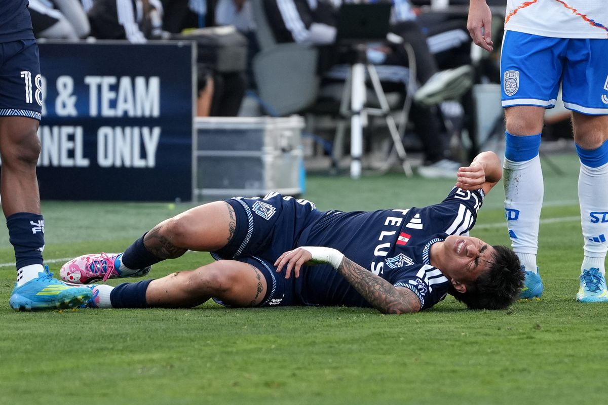 Vancouver Whitecaps forward Kenji Cabrera (17) lays on the field in pain during an MLS soccer game against the San Diego FC, Saturday May 23, 2026 in San Diego, California.