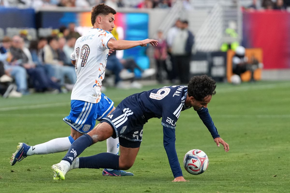 San Diego FC midfielder David Vazquez (19) battles for the ball during an MLS soccer game against the Vancouver Whitecaps, Saturday May 23, 2026 in San Diego, California.