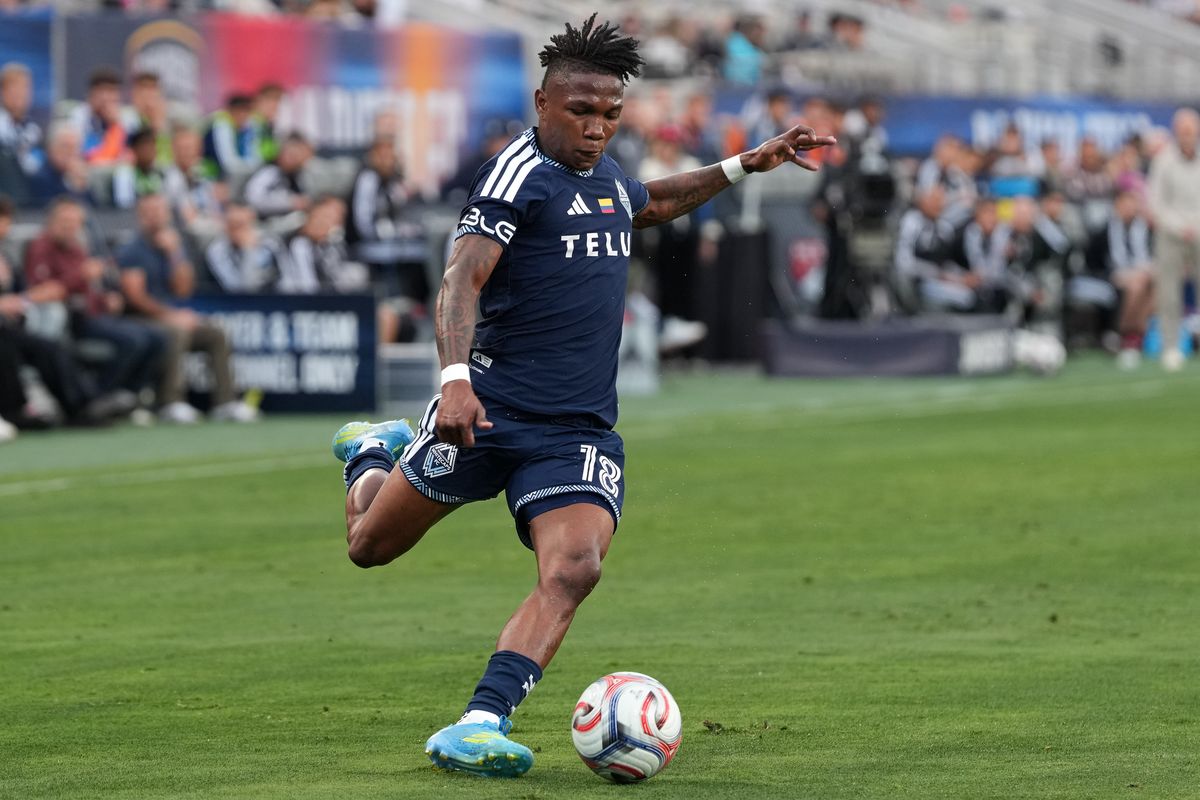 Vancouver Whitecaps defender Édier Ocampo (18) crosses the ball during an MLS soccer game against the San Diego FC, Saturday May 23, 2026 in San Diego, California.