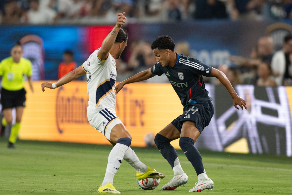 San Diego FC midfielder Elias Achouri (99) dribbles the ball against a LA Galaxy defender during an MLS match between Los Angeles Galaxy and San Diego SC on Saturday, August 29, 2026 at Snapdragon Stadium in San Diego, California. San Diego FC midfielder Elias Achouri (99) dribbles the ball against a LA Galaxy defender during an MLS match between Los Angeles Galaxy and San Diego SC on Saturday, August 29, 2026 at Snapdragon Stadium in San Diego, California.