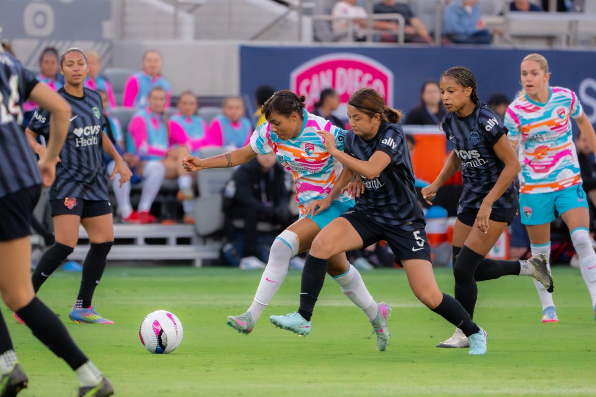 San Diego Wave Midfielder Gia Corley #11 battling for the ball during a match against the Washington Spirit on June 22, 2025 in San Diego, CA.