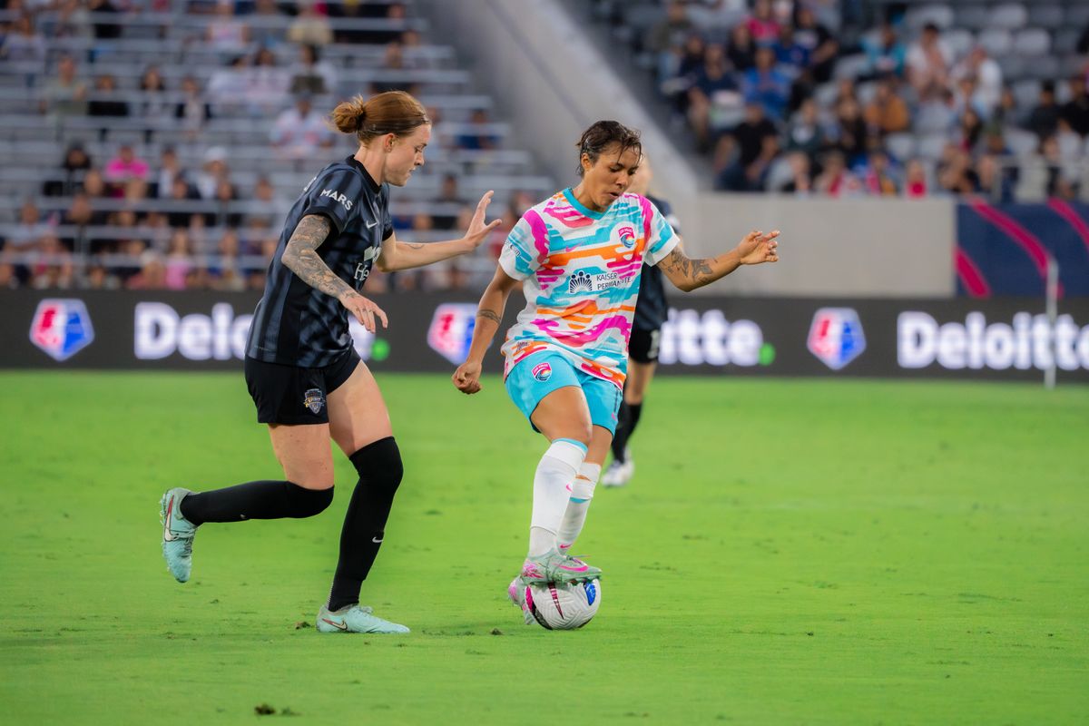 San Diego Wave Midfielder Gia Corley #11 maintaining possession of the ball during a match against the Washington Spirit on June 22, 2025 in San Diego, CA.
