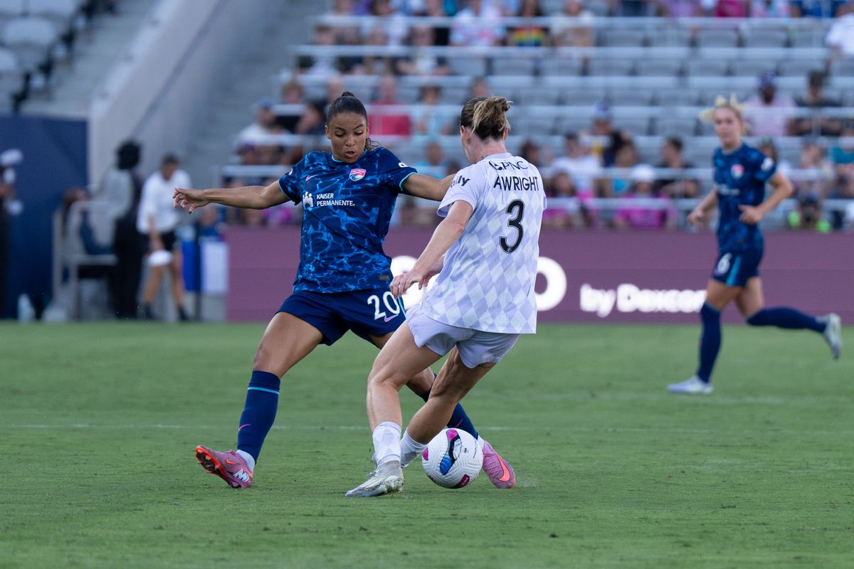 San Diego Wave FC forward Delphine Cascarino (20) battles for the ball during an NWSL soccer game against the Racing Louisville FC, Sunday August 24, 2025 in San Diego, California.