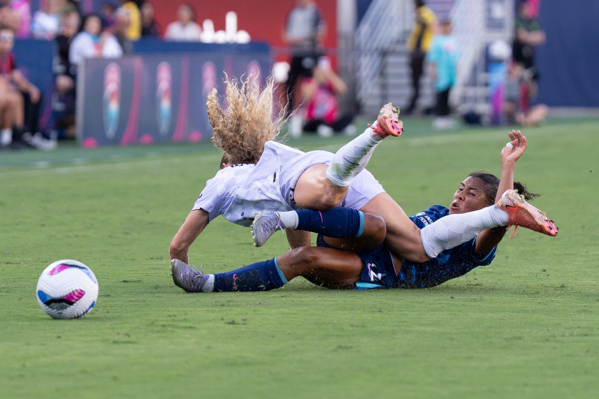 San Diego Wave FC defender Kennedy Wesley (12) tackles for the ball during an NWSL soccer game against the Racing Louisville FC, Sunday August 24, 2025 in San Diego, California.