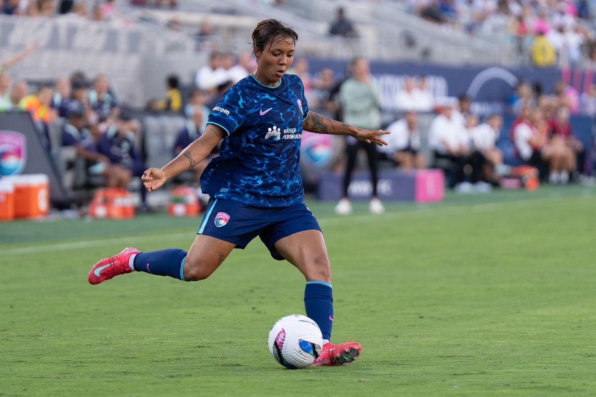 San Diego Wave FC midfielder Gia Corley (11) crosses the ball during an NWSL soccer game against the Racing Louisville FC, Sunday August 24, 2025 in San Diego, California.