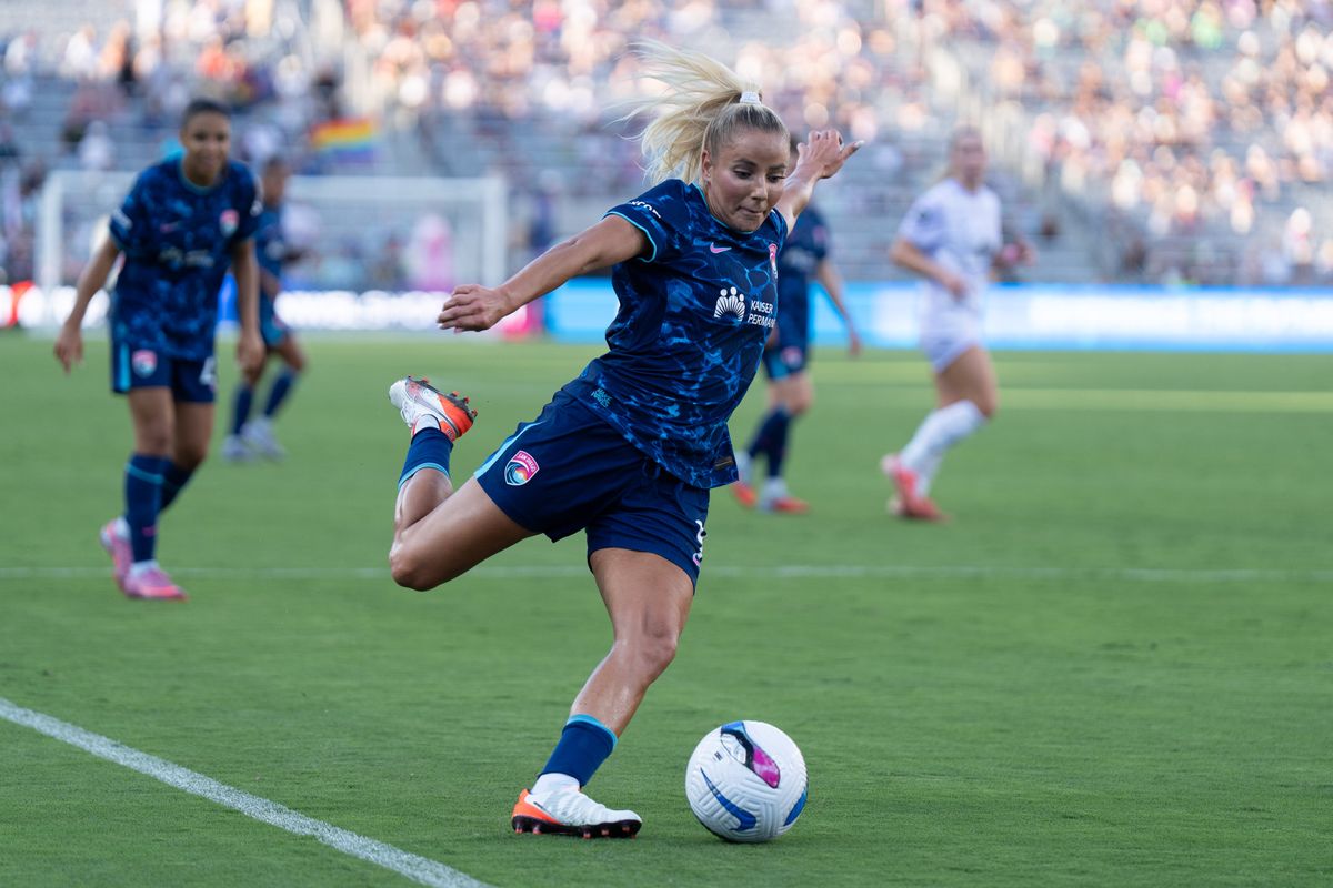 San Diego Wave FC forward Adriana Leon (9) crosses the ball during an NWSL soccer game against the Racing Louisville FC, Sunday August 24, 2025 in San Diego, California.