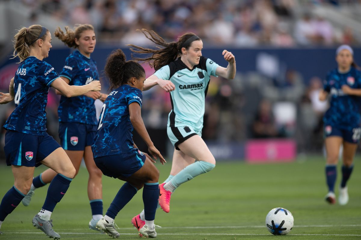 Gotham FC midfielder Rose Lavelle (16) pushes the ball past San Diego Wave defenders during an NWSL match between Gotham FC and San Diego Wave on Saturday, July 4, 2026 at Snapdragon Stadium in San Diego California Gotham FC midfielder Rose Lavelle (16) pushes the ball past San Diego Wave defenders during an NWSL match between Gotham FC and San Diego Wave on Saturday, July 4, 2026 at Snapdragon Stadium in San Diego California