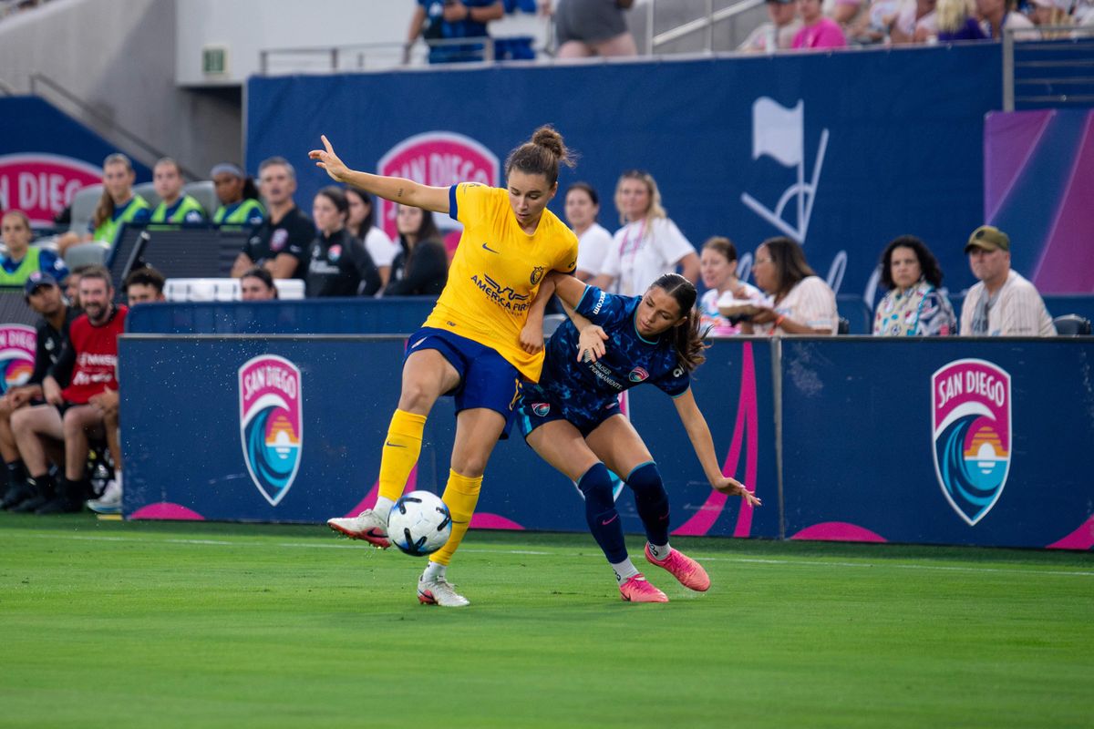 San Diego Wave FC forward Melanie Barcenas (7) fights for the ball against Utah Royals FC midfielder Ana Tejada (17) during an MLS game, Friday, August 21, 2026 in San Diego, California.