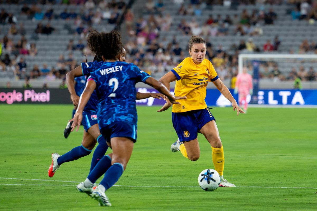 Utah Royals FC midfielder Ana Tejada dribbles through an NWSL game against San Diego Wave FC, Friday, August 21, 2026 in San Diego, California