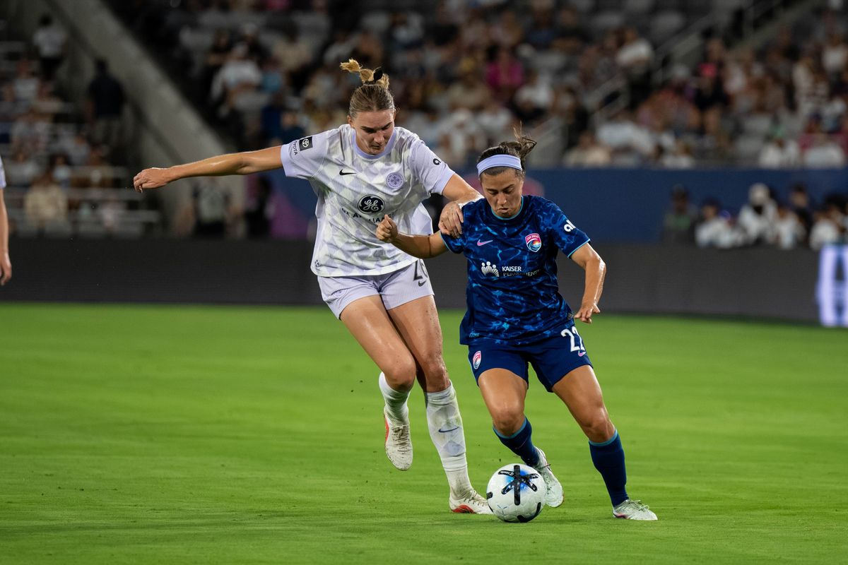 San Diego Wave FC midfielder Lia Godfrey battles for the ball against Racing Louisville FC midfielder Taylor Flint NWSL soccer game, Friday, August 28, 2026 in San Diego, California. San Diego Wave FC midfielder Lia Godfrey battles for the ball against Racing Louisville FC midfielder Taylor Flint NWSL soccer game, Friday, August 28, 2026 in San Diego, California.