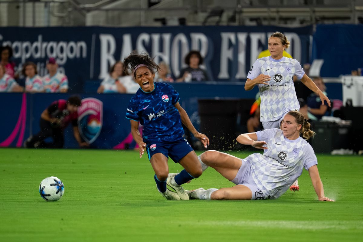 Racing Louisville FC midfielder Taylor Flint (26) tackles San Diego Wave defender Perle Morroni during an NWSL soccer game, Friday, August 28, 2026 in San Diego, California Racing Louisville FC midfielder Taylor Flint (26) tackles San Diego Wave defender Perle Morroni during an NWSL soccer game, Friday, August 28, 2026 in San Diego, California