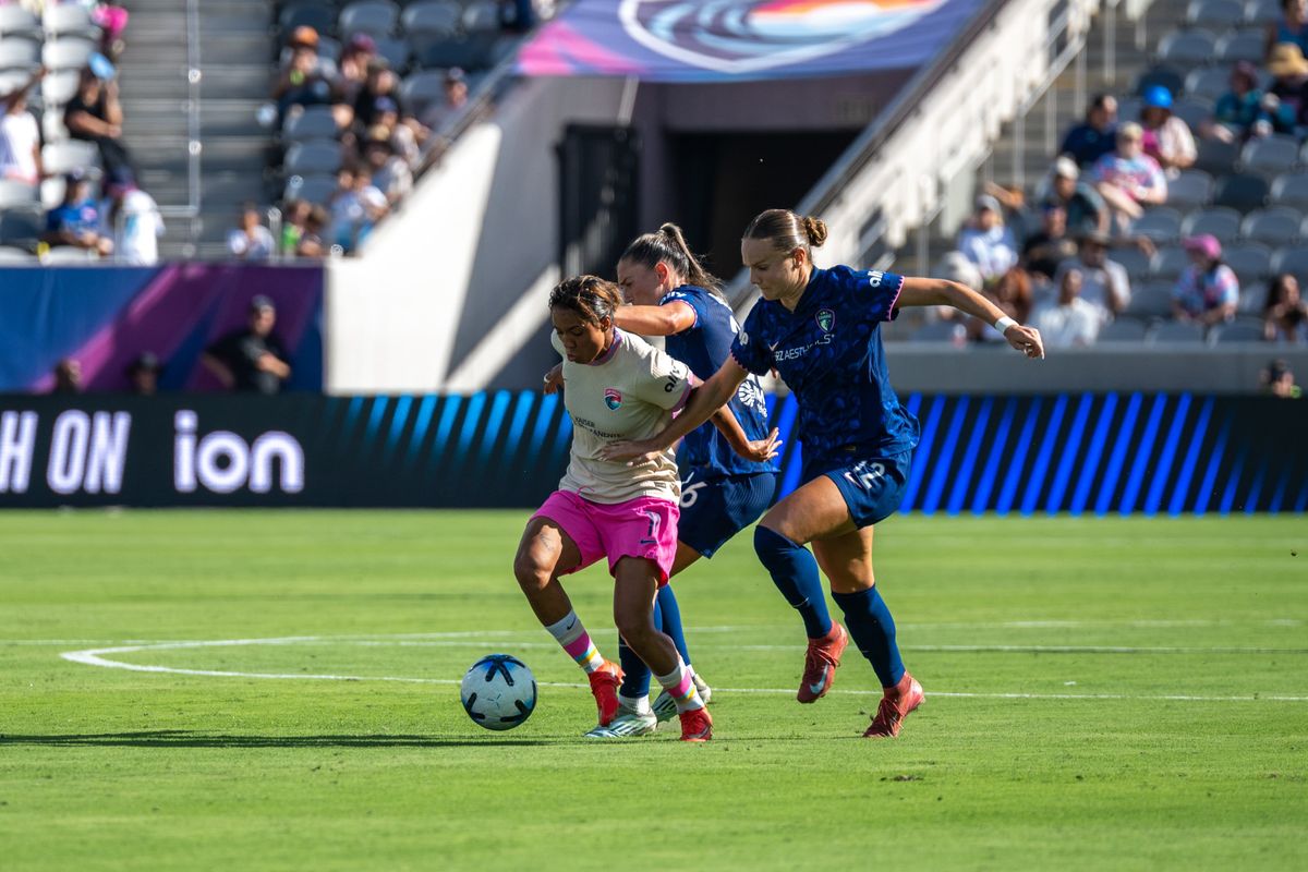 San Diego Wave FC midfielder Gia Corley attempts to escape pressure during an NWSL soccer game against NC Courage, Saturday, September 12, 2026 in San Diego, California.