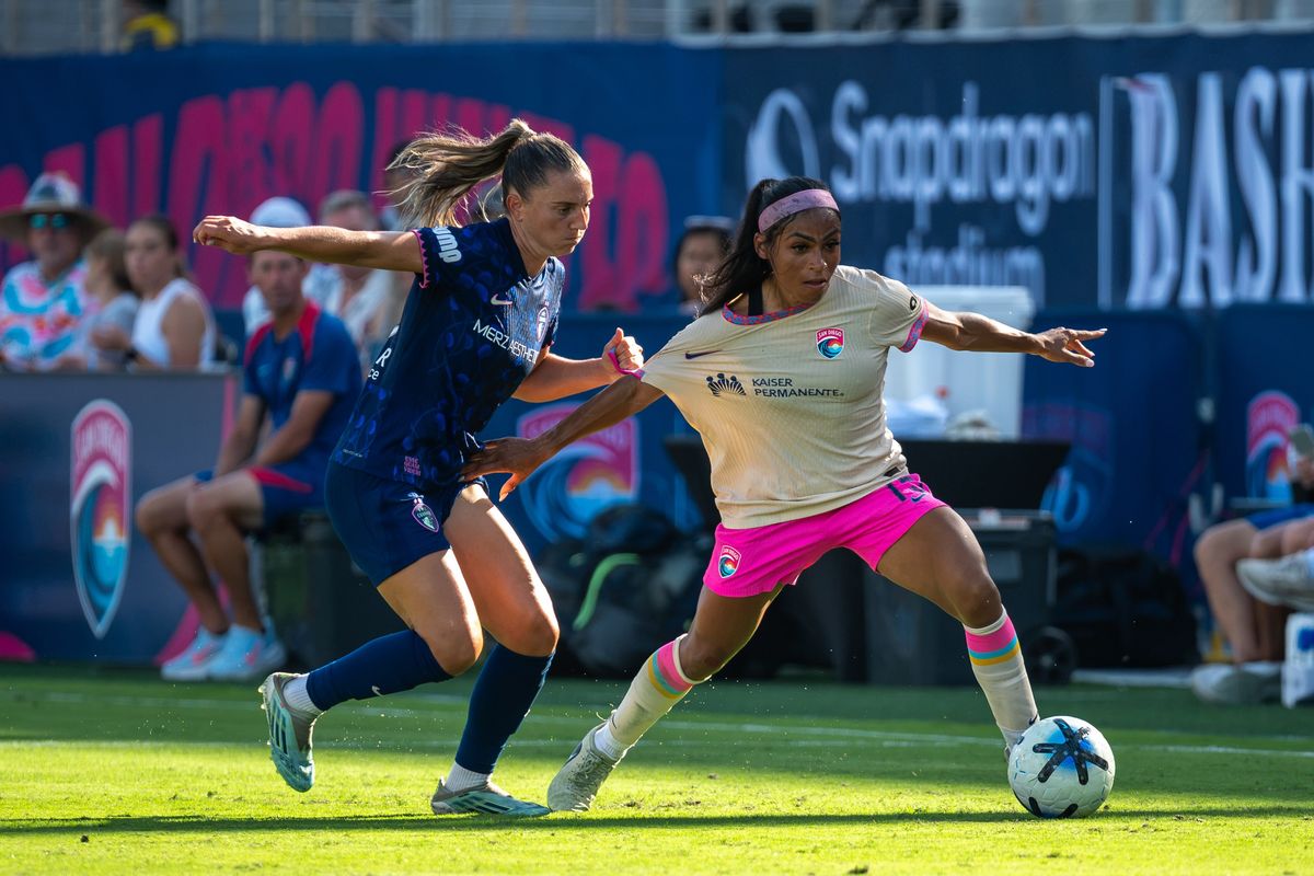 San Diego Wave FC defender Perle Morroni fights for the ball against NC Courage midfielder Vilde Bøe Risa during an NWSL soccer game, Saturday, September 12, 2026 in San Diego, California.