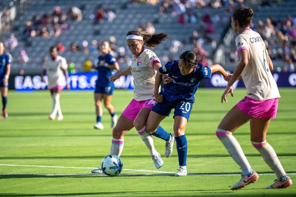 San Diego Wave FC midfielder Lia Godfrey fights for the ball against NC Courage midfielder Shinomi Koyama during an NWSL soccer game, Saturday, September 12, 2026 in San Diego, California.