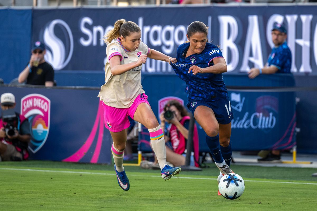 San Diego Wave FC midfielder Laila Harbert fights for the ball against NC Courage midfielder Carly Wickenheiser during an NWSL soccer game, Saturday, September 12, 2026 in San Diego, California.