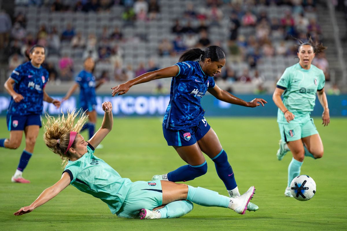 San Diego Wave FC forward Trinity Byars is tackled by KC Current defender Kayla Sharples during an NWSL soccer game, Friday, September 18, 2026 in San Diego, California. San Diego Wave FC forward Trinity Byars is tackled by KC Current defender Kayla Sharples during an NWSL soccer game, Friday, September 18, 2026 in San Diego, California.