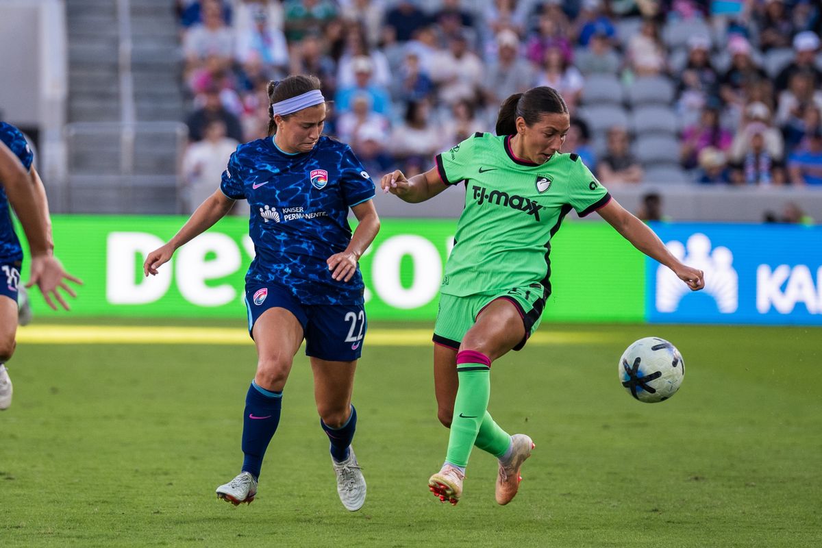San Diego Wave FC midfielder Lia Godfrey fights for the ball against Boston Legacy midfielder Bárbara Olivieri during an NWSL soccer game, Sunday, October 25, 2026 in San Diego, California.