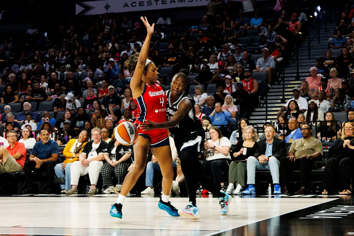 Las Vegas Aces guard Jewell Loyd (24) passes the ball around a defender during a WNBA game against the Washington Mystics on Tuesday, August 13, 2026, at Michelob ULTRA Arena in Las Vegas, Nevada. Las Vegas Aces guard Jewell Loyd (24) passes the ball around a defender during a WNBA game against the Washington Mystics on Tuesday, August 13, 2026, at Michelob ULTRA Arena in Las Vegas, Nevada.
