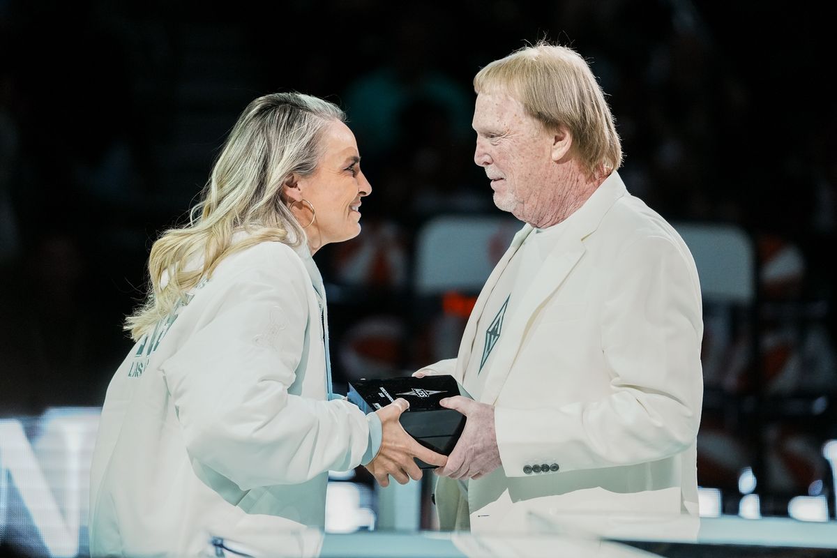 Las Vegas Aces coach Becky Hammon accepts ring from team owner Mark Davis during the championship ring ceremony prior to WNBA game against Phoenix Mercury on Saturday May 9, 2026 at T-Mobile Arena in Las Vegas. Las Vegas Aces coach Becky Hammon accepts ring from team owner Mark Davis during the championship ring ceremony prior to WNBA game against Phoenix Mercury on Saturday May 9, 2026 at T-Mobile Arena in Las Vegas.
