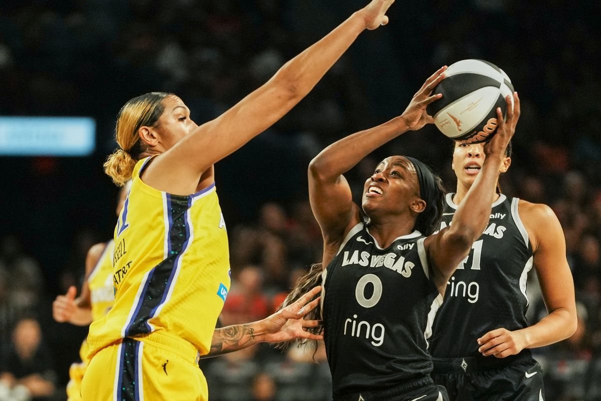 Las Vegas Aces guard Jackie Young (0) eyes the basket while guarded by Los Angles sparks center Mercedes Russell during WNBA game against Los Angeles Sparks on Friday May 30, 2025 in Las Vegas.  