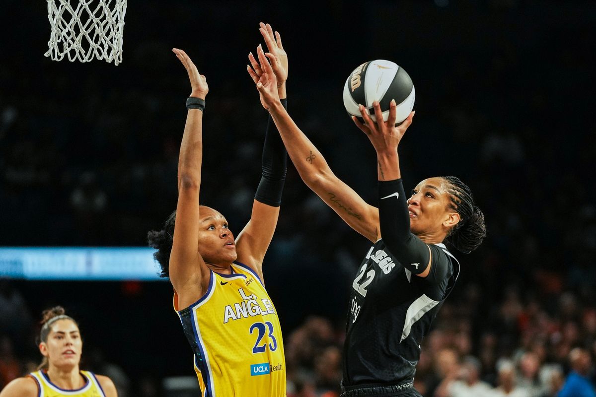 Las Vegas Aces center A’ja Wilson (22) goes for a layup while guarded by Azurá Stevens (23) during WNBA game against Los Angeles Sparks on Friday May 30, 2025 in Las Vegas.  