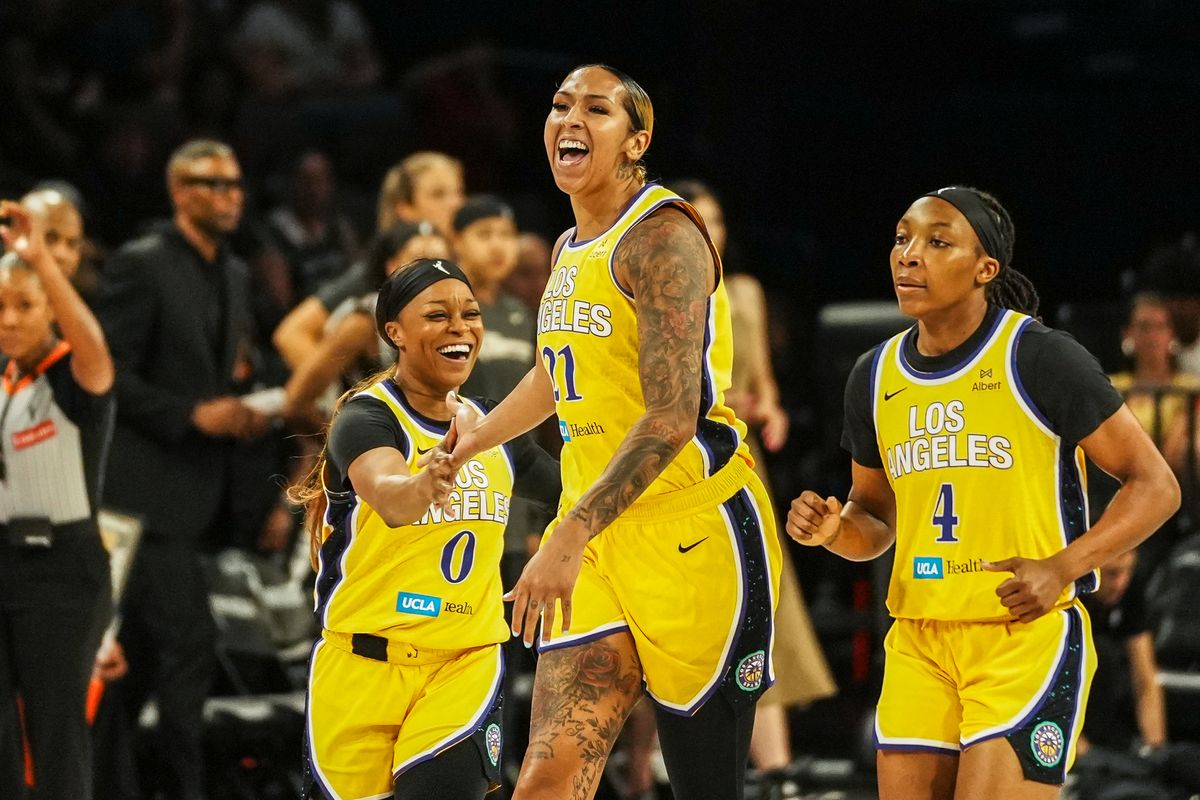  Los Angeles Sparks guard Odyssey Sims (0) and center Mercedes Russell (21) celebrate a successful play during WNBA game against Las Vegas Aces on Wednesday June 11, 2025 in Las Vegas.  