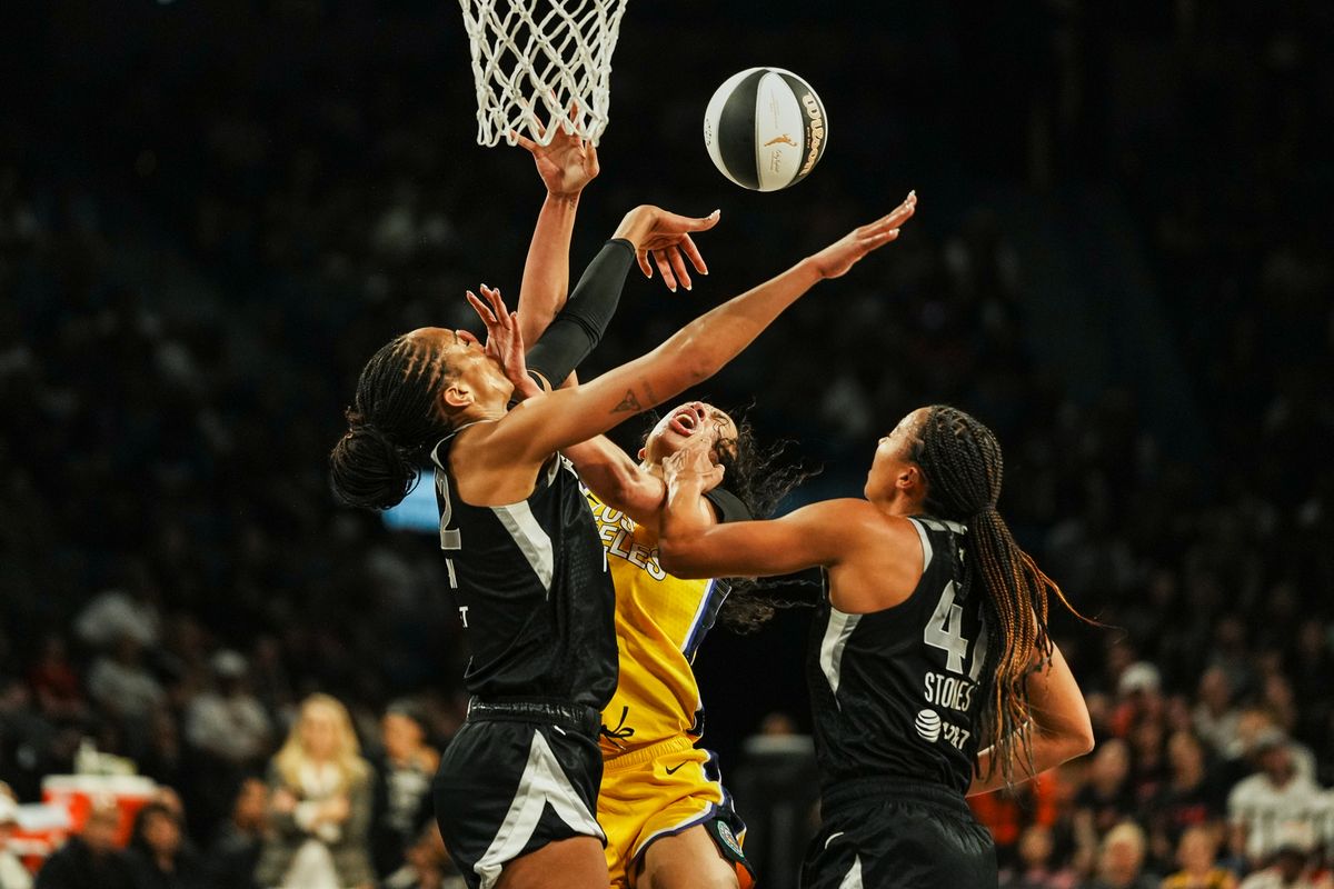 Las Vegas Aces A’ja Wilson (22), Kiah Stokes (41) and Los Angles Sparks Dearica Hamby (5) get tangled up going for a rebound  during WNBA game against Los Angeles Sparks on Friday May 30, 2025 in Las Vegas.  