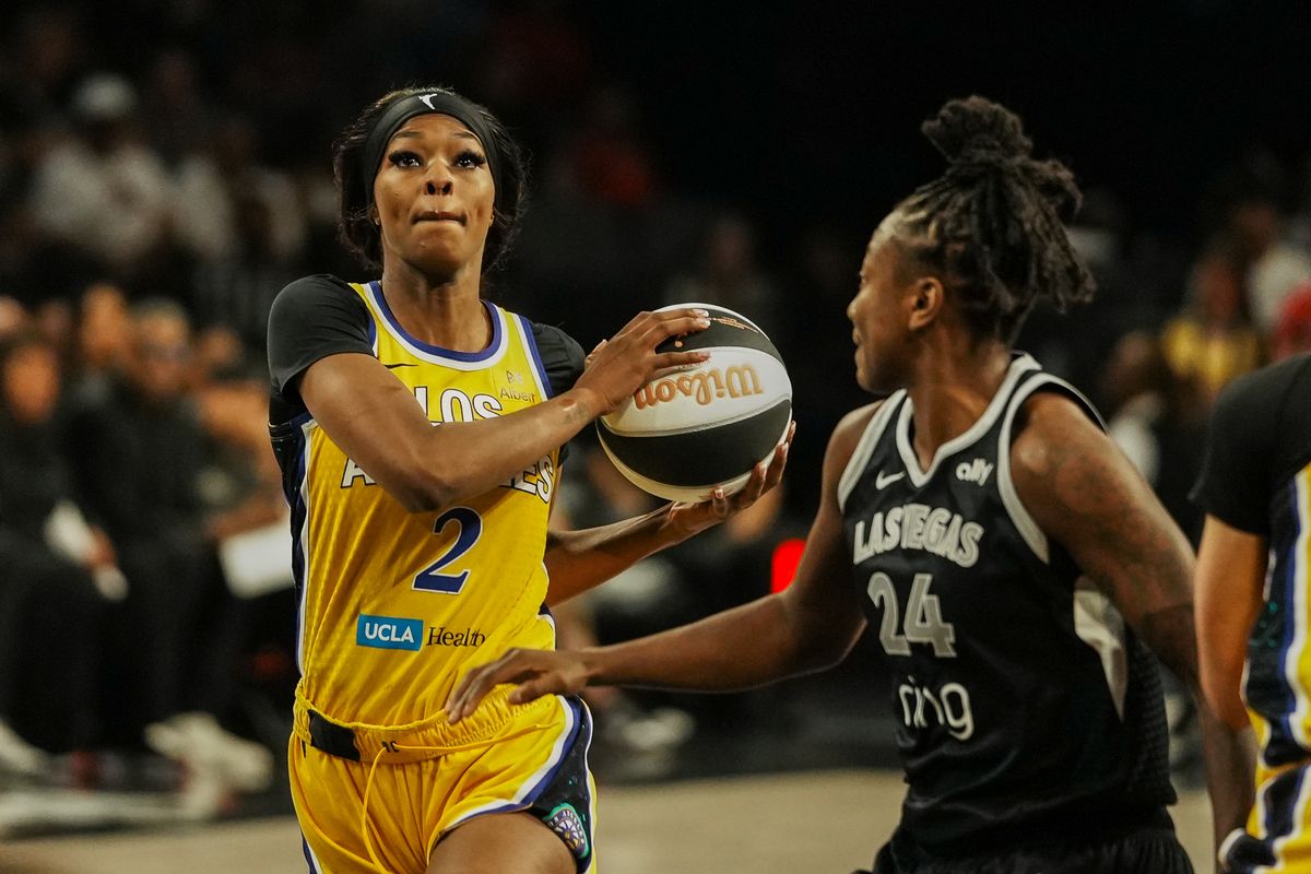 Los Angeles Sparks forward Rickea Jackson (2) drives towards the basket past Las Vegas Aces Jewell Loyd (24) during WNBA game against Las Vegas Aces on Wednesday June 11, 2025 in Las Vegas.  