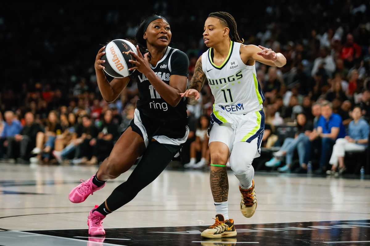  Las Vegas Aces guard Dana Evans (11) drives to the basket while Dallas Wings guard JJ Quinerly (11) tries to stop her during a WNBA game between the Las Vegas Aces and the Dallas Wings, Friday June 13, 2025 in Las Vegas, Nev.