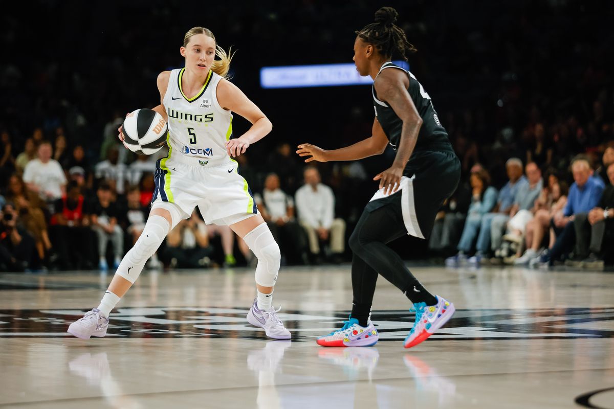 Dallas Wings guard Paige Bueckers (5) does a crossover dribble on Las Vegas Aces guard Jewell Loyd (24) during a WNBA game between the Las Vegas Aces and the Dallas Wings, Friday June 13, 2025 in Las Vegas, Nev.