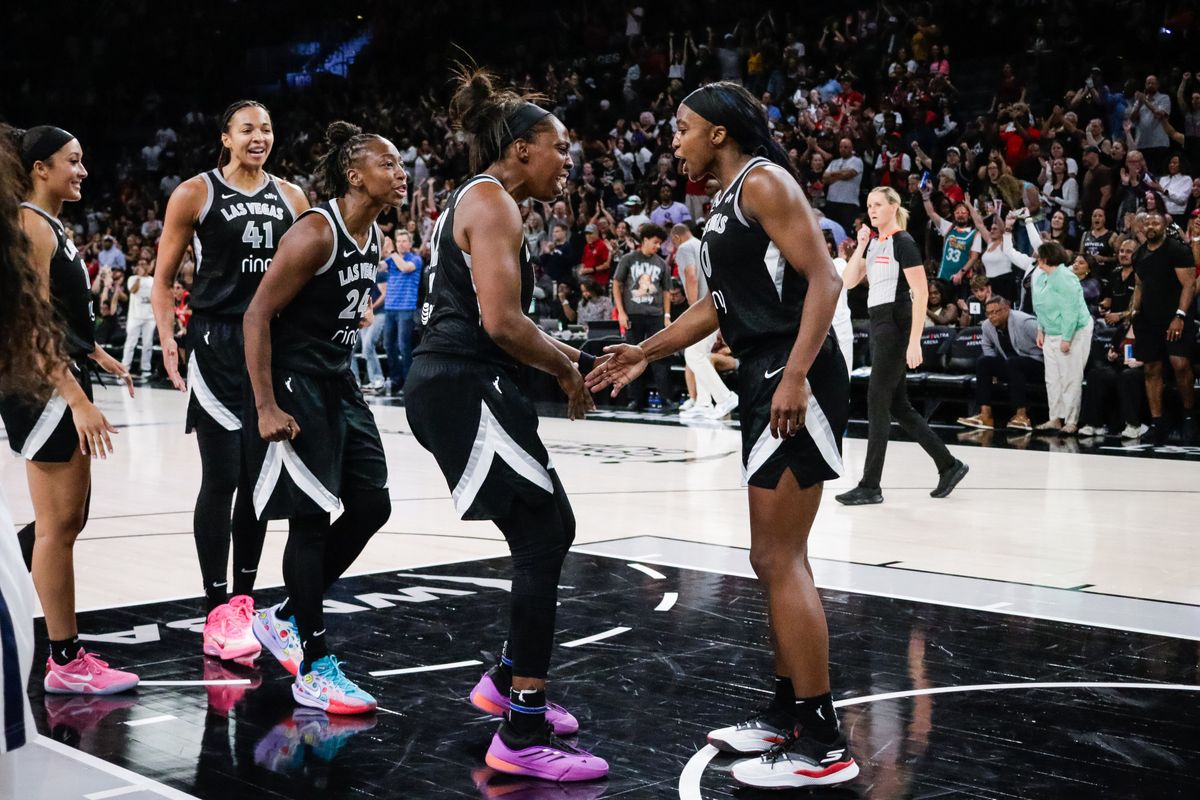  Las Vegas Aces players celebrate after the final buzzer after a WNBA game between the Las Vegas Aces and the Dallas Wings, Friday June 13, 2025 in Las Vegas, Nev.