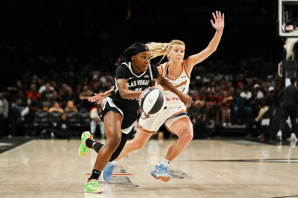 Las Vegas Aces guard Dana Evans (11)  drives towards the basket guarded by Pheonix Mercury Lexi Held (1) during WNBA game against Pheonix Mercury on Sunday June 15, 2025 in Las Vegas.  