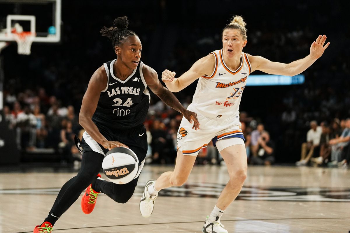 Las Vegas Aces guard Jewell Loyd (24)  takes the ball down the court guardedby Pheonix Mercury Sami Whitcomb (33) during WNBA game against Pheonix Mercury on Sunday June 15, 2025 in Las Vegas.  