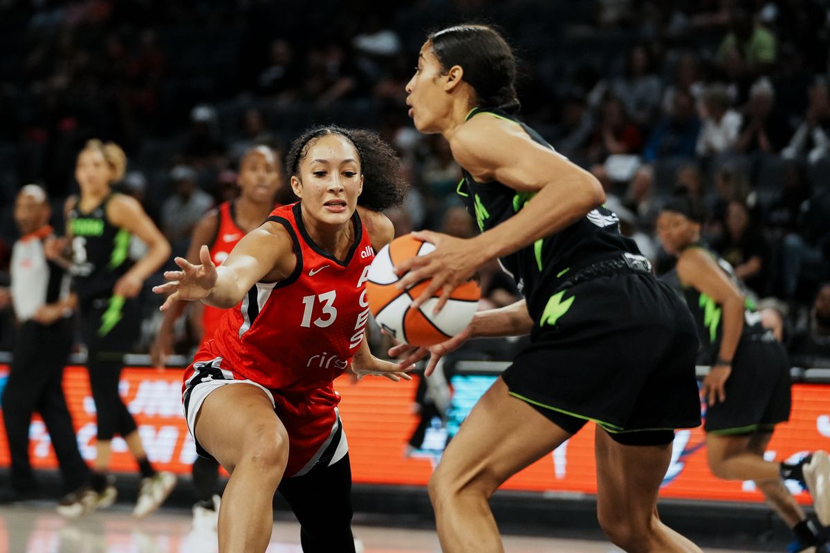 Las Vegas Aces guard Aaliyah Nye (13) reaches for the ball while Seattle Storm guard Skylar Diggins (4) takes the ball down the court during WNBA game against Seattle Storm on Friday June 20 2025 in Las Vegas.