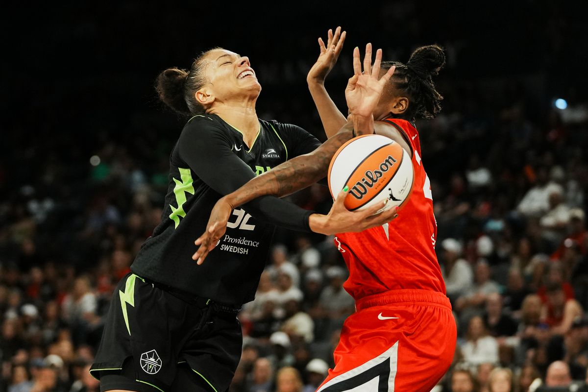 Seattle Storm forward Alysha Clark (32) attempts to make a layup while guarded by Las Vegas Aces Jewell Loyd (24) during WNBA game against Las Vegas Aces on Friday June 20, 2025 in Las Vegas.  