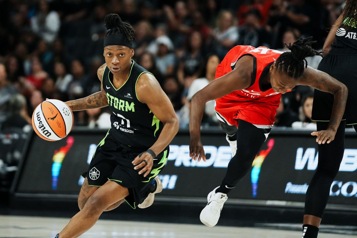 Seattle Storm guard Erica Wheeler (17) drives towards the basket while Las Vegas Aces Jewell Loyd (24) falls on the court behind her during WNBA game against Las Vegas Aces on Friday June 20, 2025 in Las Vegas.