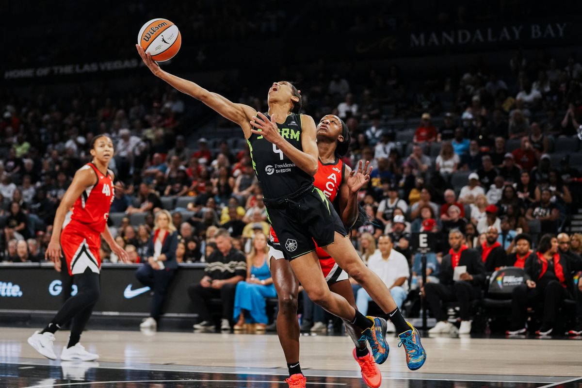 Seattle Storm guard Skylar Diggins (4) attempts a layup over Las Vegas Aces Jackie Young (0) during WNBA game against Las Vegas Aces on Friday June 20, 2025 in Las Vegas.