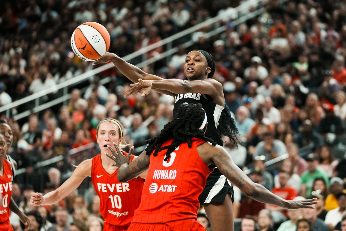 Las Vegas Aces guard Jackie Young (0 passes the ball over Indiana Fever Natasha Howard (6) during WNBA game against Indiana Fever on Sunday June 22 2025 in Las Vegas.  
