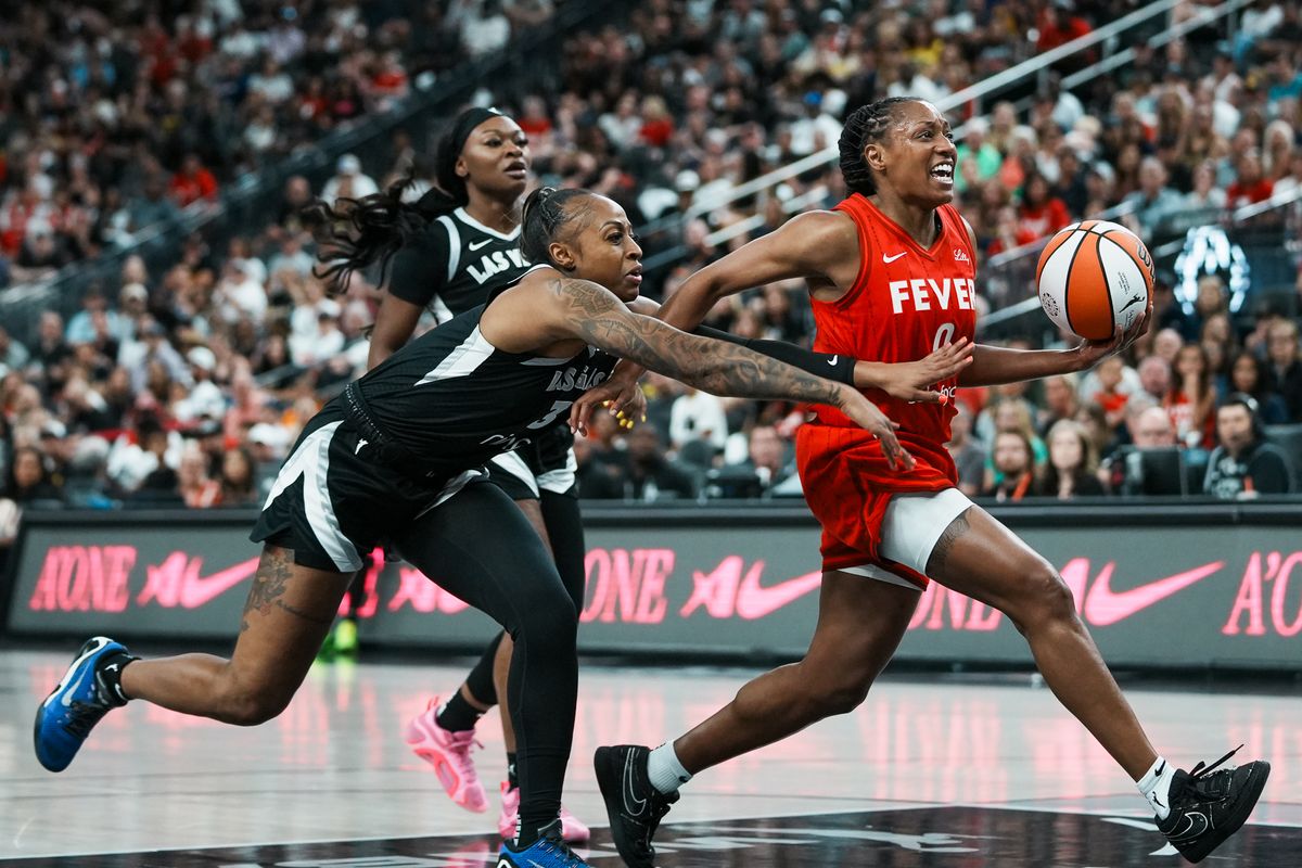 Indiana Fever guard Kelsey Mitchell (0) takes the ball down the court while Las Vegas Aces guard Tiffany Mitchell (3) tries to gain control of the ball during WNBA game against Las Vegas Aces on Sunday June 22, 2025 in Las Vegas.  