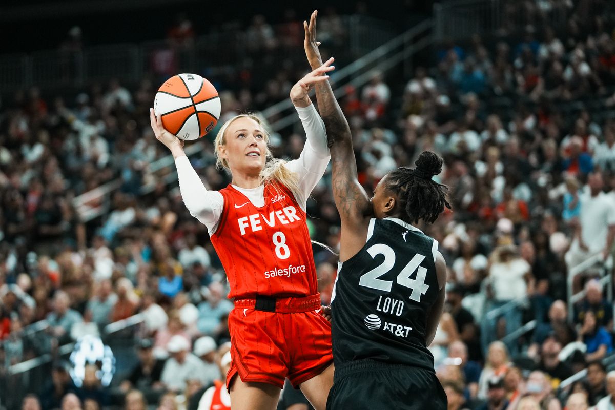 Indiana Fever guard Sophie Cunningham (8) shoots the ball over Las Vegas Aces Jewell Loyd (24) during WNBA game against Las Vegas Aces on Sunday June 22, 2025 in Las Vegas.  