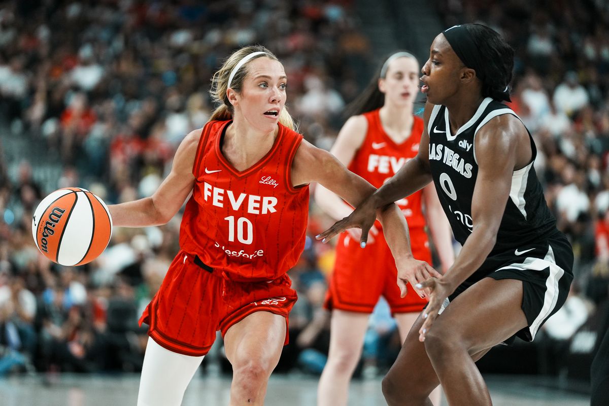 Indiana Fever guard Lexie Hull (10) drives towards the basket while guarded by Las Vegas Aces Jackie Young (0) during WNBA game against Las Vegas Aces on Sunday June 22, 2025 in Las Vegas.  