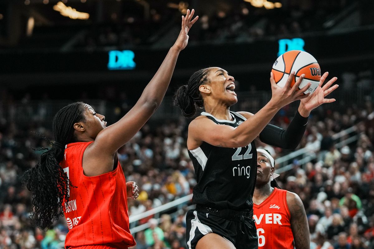 Las Vegas Aces center A’ja Wilson (22) attempts a layup while guarded by  Indiana Fever Aliyah Boston (7) during WNBA game against Indiana Fever on Sunday June 22 2025 in Las Vegas.  