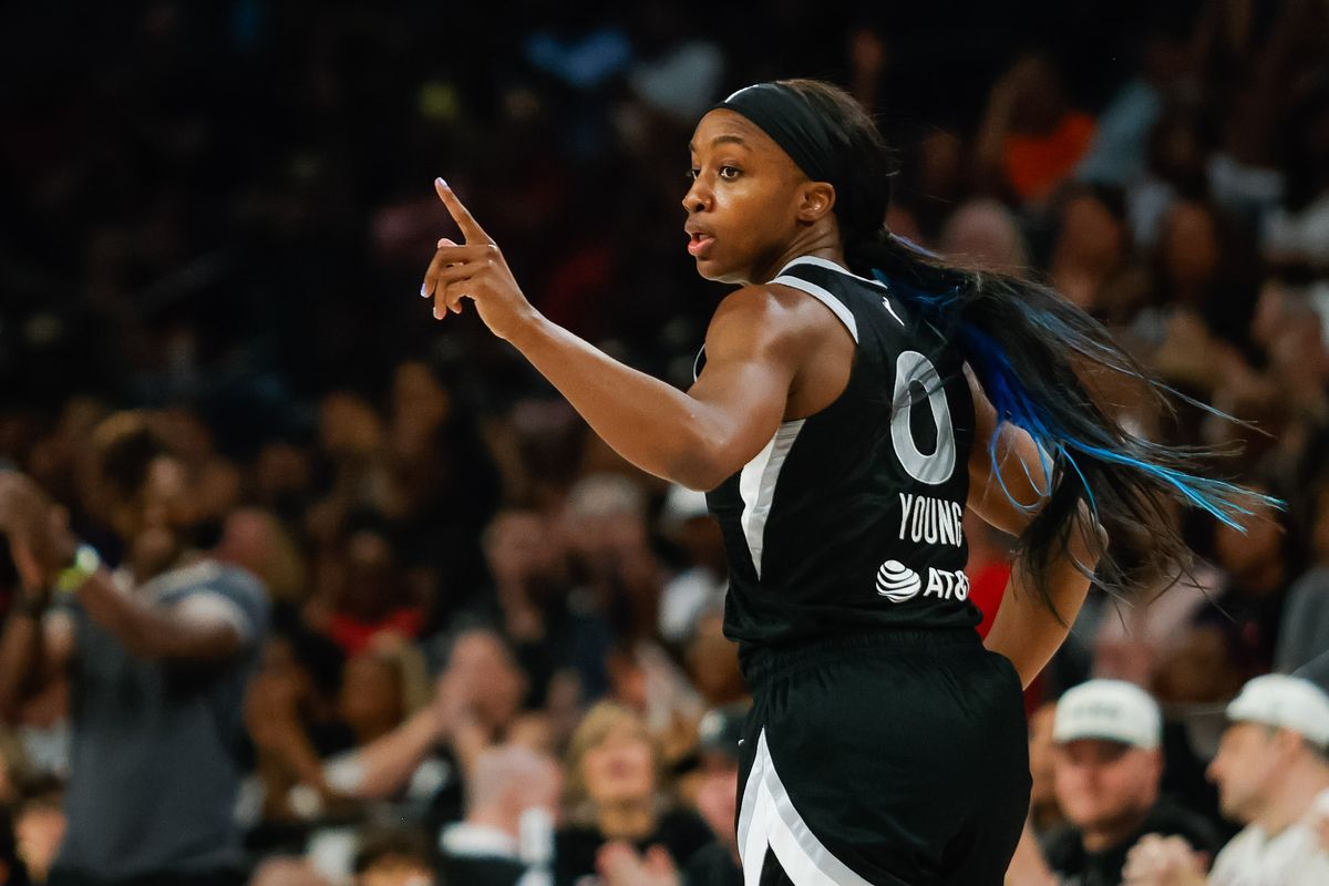Las Vegas Aces guard Jackie Young (0) points to teammates after scoring a basket during a WNBA game between the Las Vegas Aces and the Connecticut Sun, Wednesday June 25, 2025 in Las Vegas, Nev.