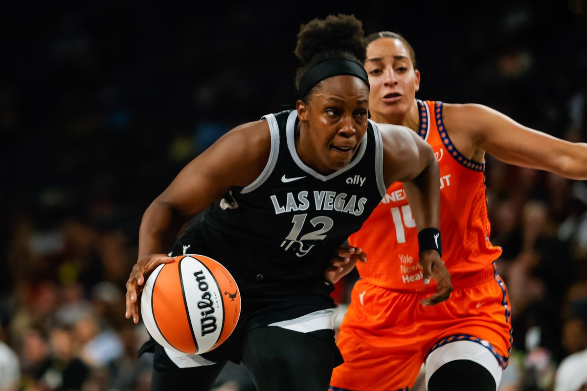 Las Vegas Aces guard Chelsea Gray (12) drives to the basket during a WNBA game between the Las Vegas Aces and the Connecticut Sun, Wednesday June 25, 2025 in Las Vegas, Nev.