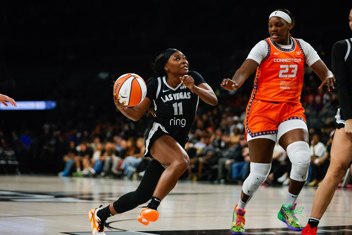 Las Vegas Aces guard Dana Evans (11) drives to the basket during a WNBA game between the Las Vegas Aces and the Connecticut Sun, Wednesday June 25, 2025 in Las Vegas, Nev.