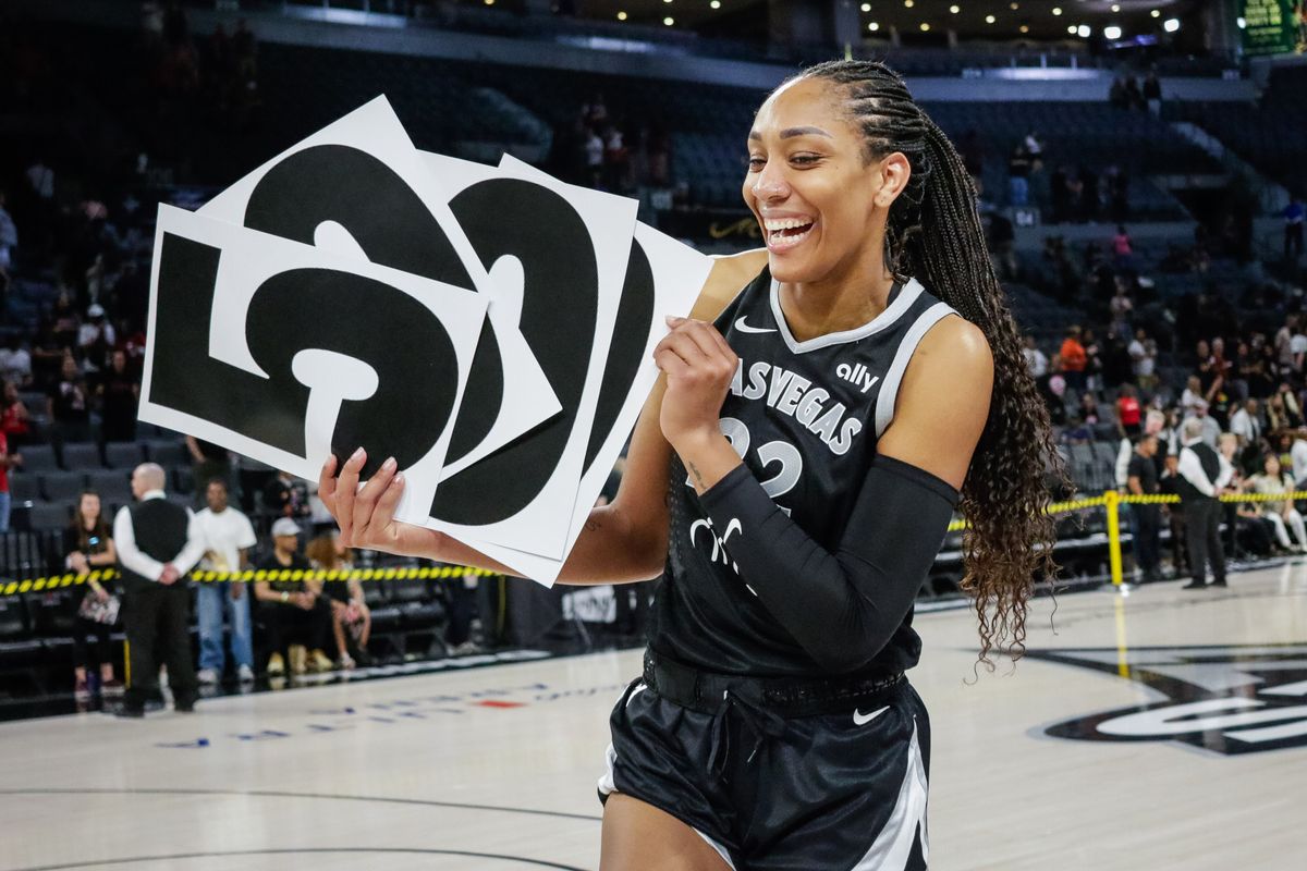 Las Vegas Aces forward A’ja Wilson (22) holds up a sign that reads “5000” after a WNBA game between the Las Vegas Aces and the Connecticut Sun, Wednesday June 25, 2025 in Las Vegas, Nev.