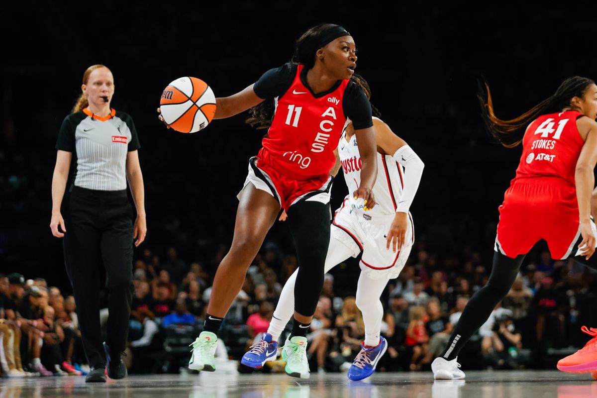 Las Vegas Aces guard Dana Evans (11) dribbles to the basket during a WNBA game between the Las Vegas Aces and the Washington Mystics, Thursday June 26, 2025 in Las Vegas, Nev.
