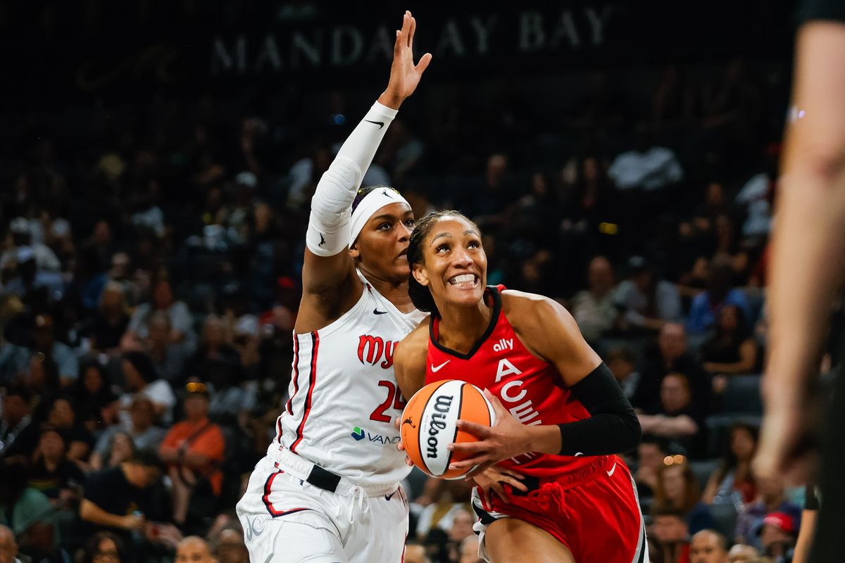Las Vegas Aces forward A’ja Wilson (22) drives to the basket as Washington Mystics forward Aaliyah Edwards (24) looks to stop her shot during a WNBA game between the Las Vegas Aces and the Washington Mystics, Thursday June 26, 2025 in Las Vegas, Nev.