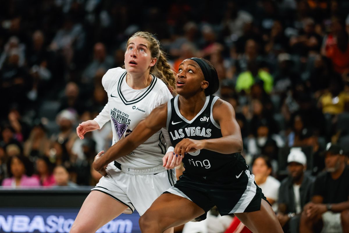 Las Vegas Aces guard Jackie Young (0) and Golden State Valkyries guard Kate Martin (20) box each other out for a rebound during a WNBA game between the Las Vegas Aces and the Golden State Valkyries, Saturday July 12, 2025 in Las Vegas, Nev.