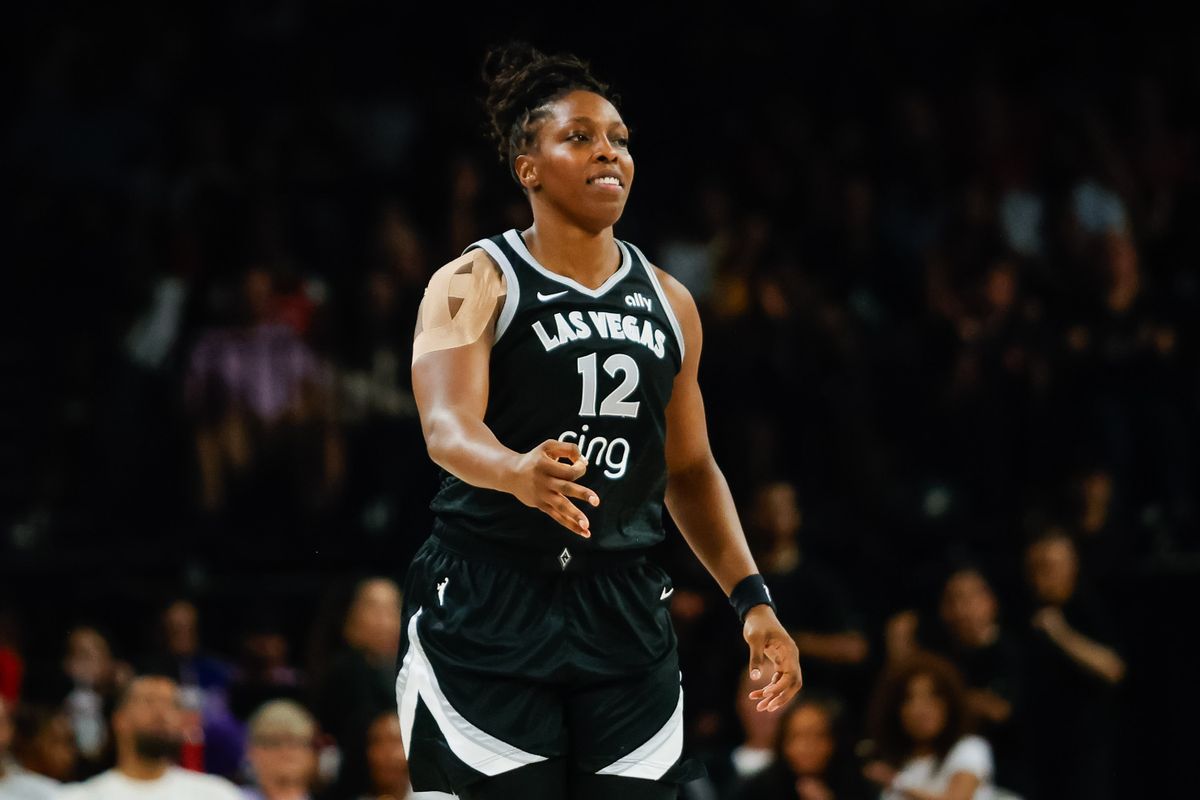 Las Vegas Aces guard Chelsea Gray (12) holds a three with her fingers in celebration after scoring a three-point basket during a WNBA game between the Las Vegas Aces and the Golden State Valkyries, Saturday July 12, 2025 in Las Vegas, Nev.